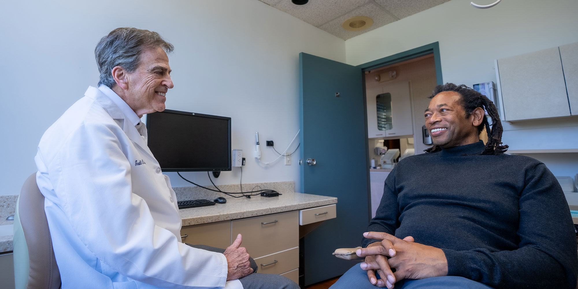 full arch implant patient smiling