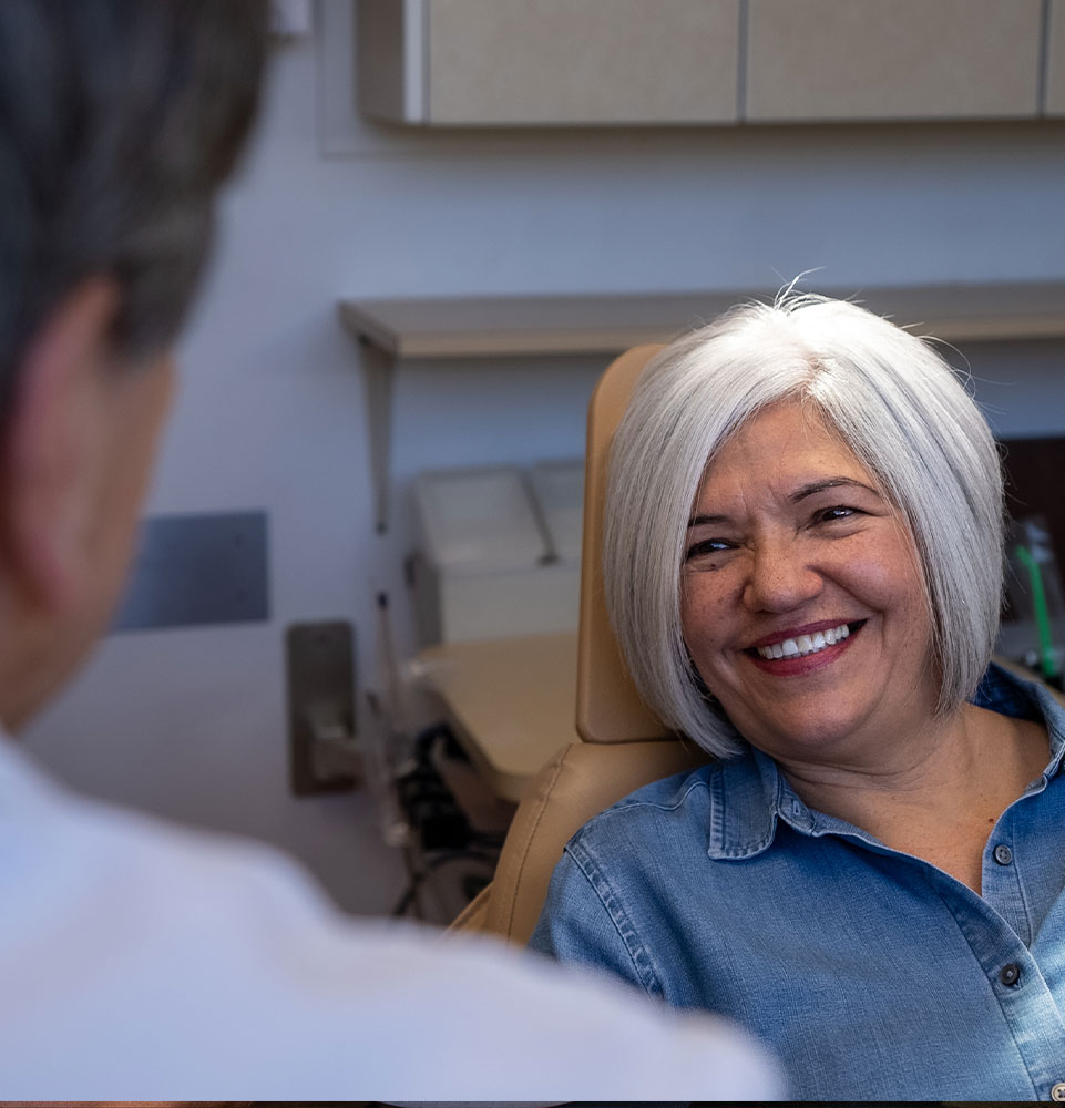 full arch dental implant patient smiling